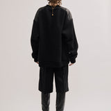 Oversized bouclé sweater with leather patches